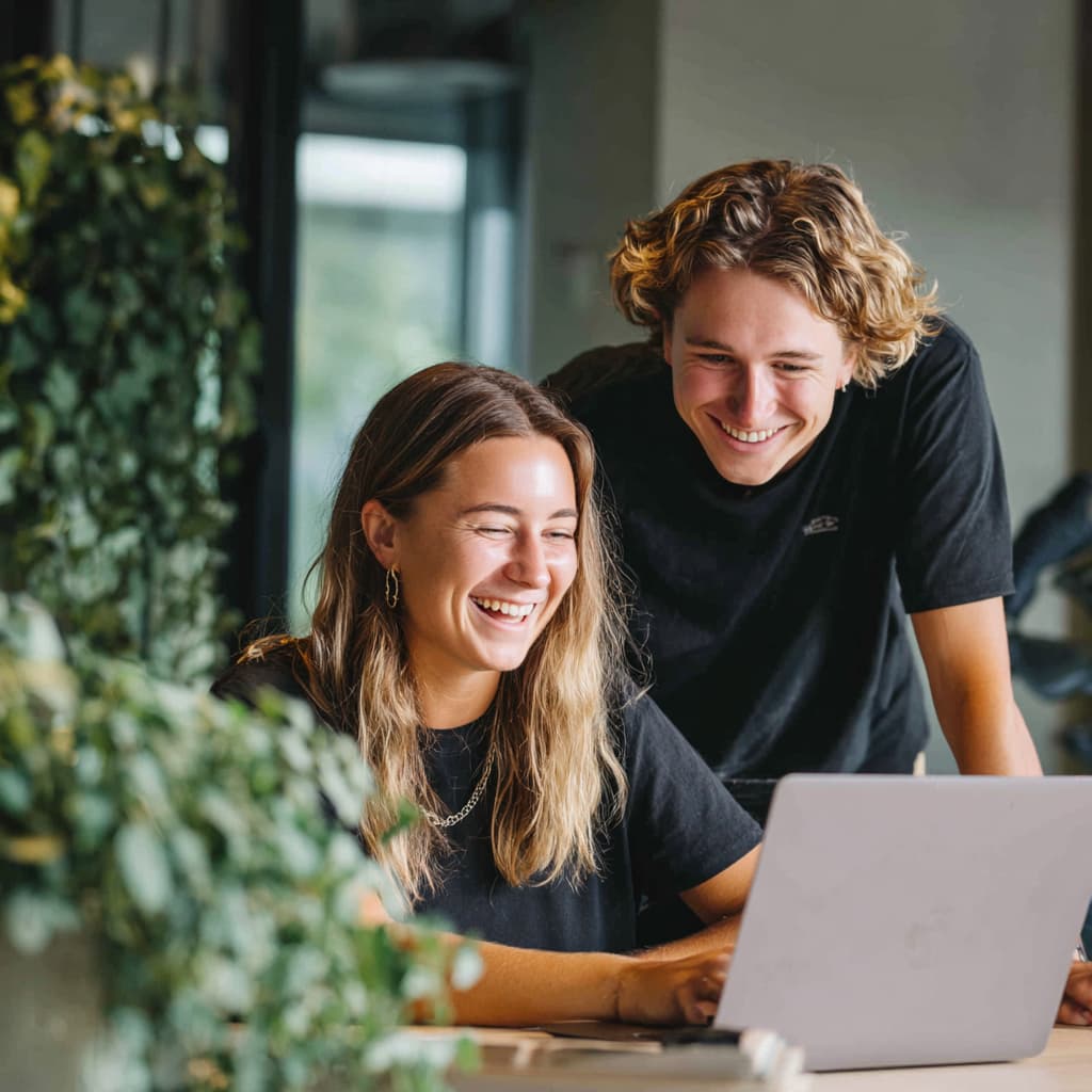 happy clients looking at their laptops